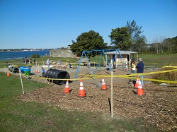 Pollution Solution Obstacle Course - roped-off area containing swingset and traffic cones