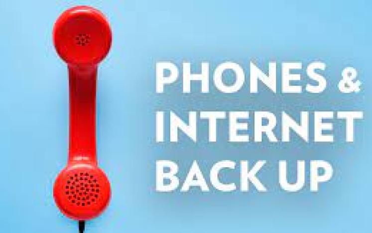 Image of a phone with text: phones & internet are back up