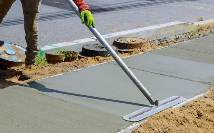 image of a person laying down concrete sidewalk